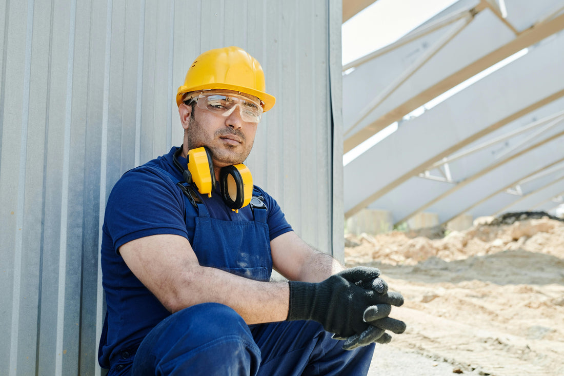 construction worker wearing cut resistant gloves. PPE concept