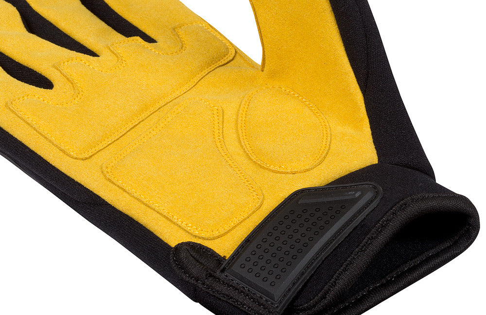 Close up view of the inner yellow palm of Safety TUFF's premium grade impact glove, including the black velcro wrist closure